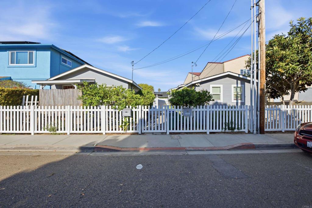 3258 Tyler Street Carlsbad, CA 92008 - Photo 18 of 20 a view of a house with a small yard and a large window
