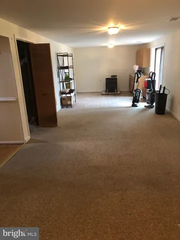 a view of a livingroom with furniture and a flat screen tv