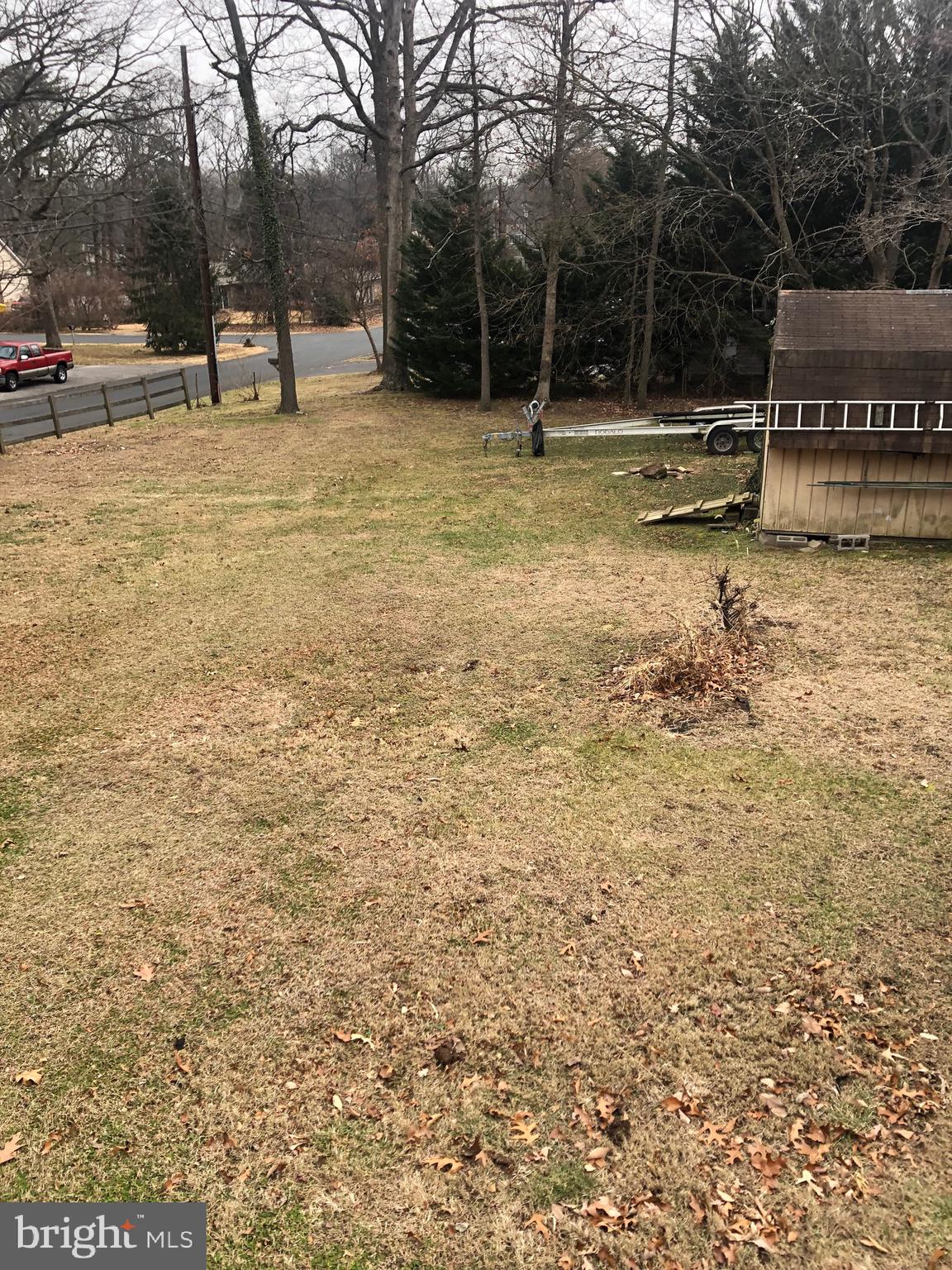 201 Southwood Road Pasadena, MD 21122 - Photo 2 of 16 a view of swimming pool with a bench and trees