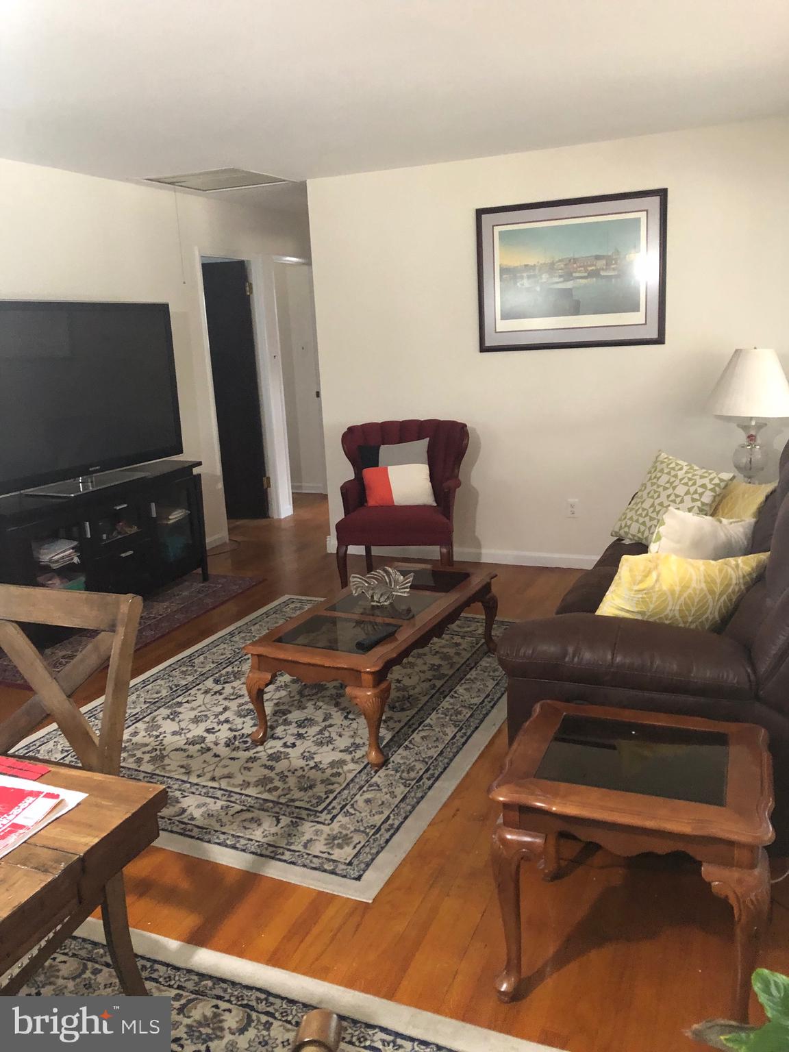 201 Southwood Road Pasadena, MD 21122 - Photo 7 of 16 a living room with furniture and a flat screen tv
