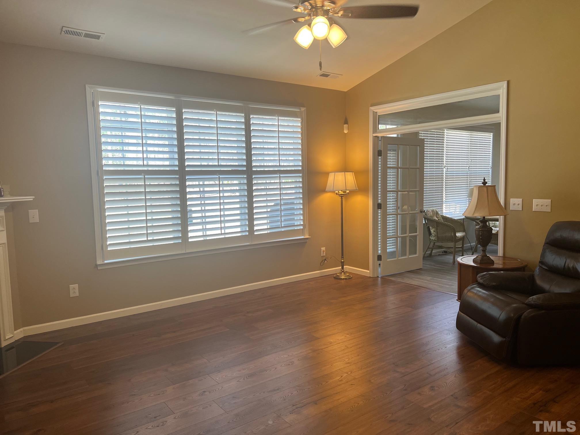 10527 Dapping Drive Raleigh, NC 27614 - Photo 13 of 20 a view of livingroom with furniture wooden floor and windows