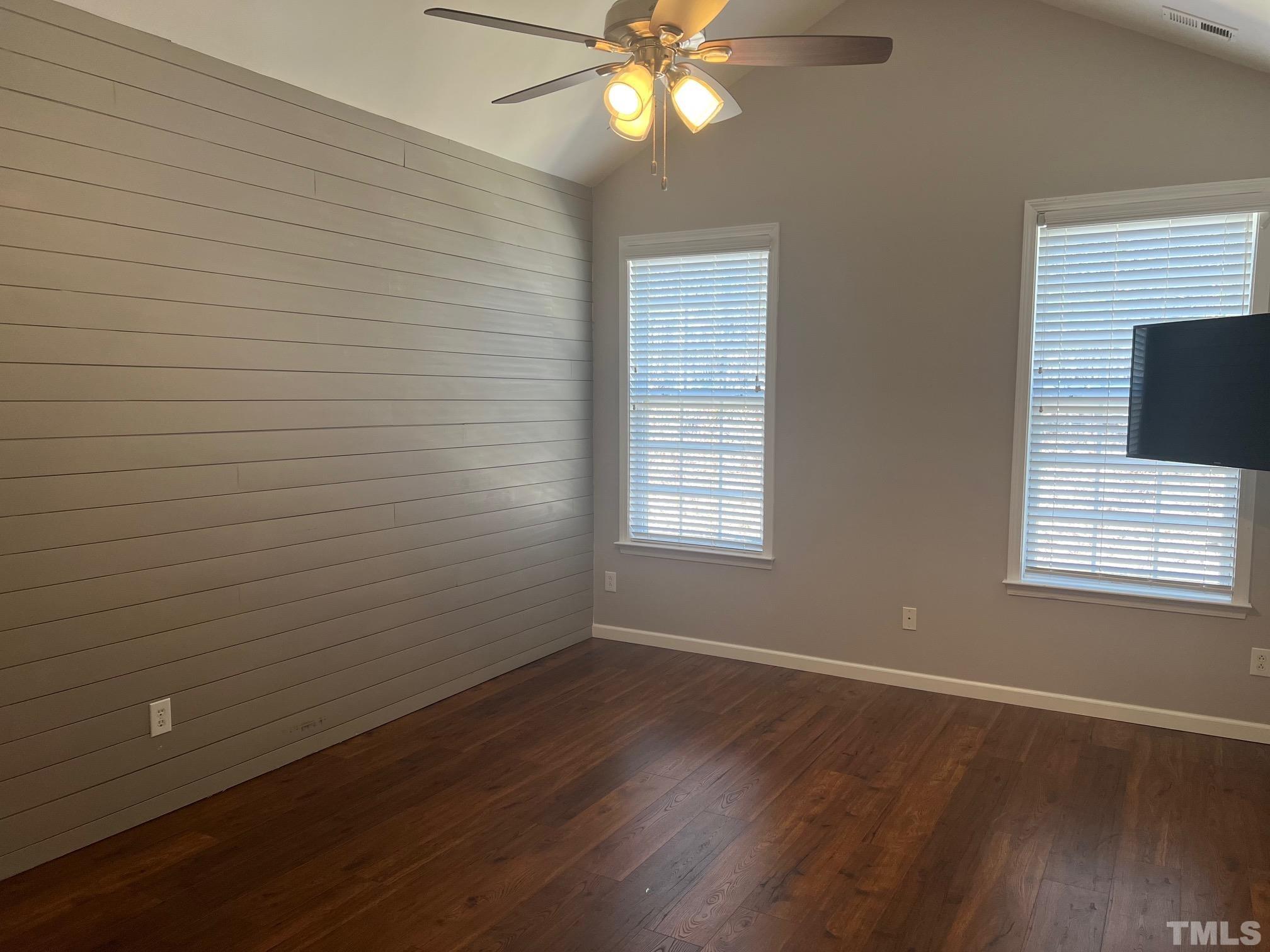10527 Dapping Drive Raleigh, NC 27614 - Photo 14 of 20 a view of an empty room with wooden floor and a window