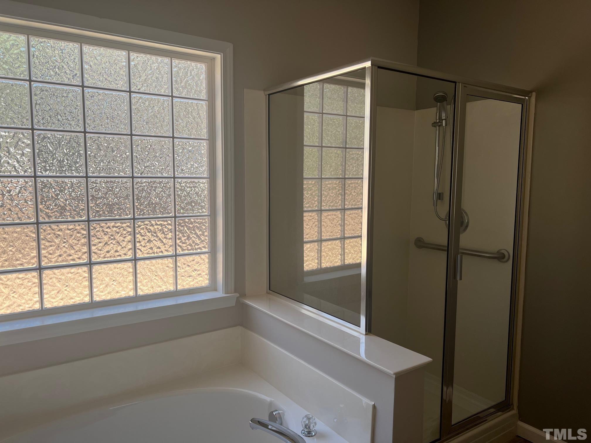 10527 Dapping Drive Raleigh, NC 27614 - Photo 16 of 20 a bathroom with a shower and a bathtub