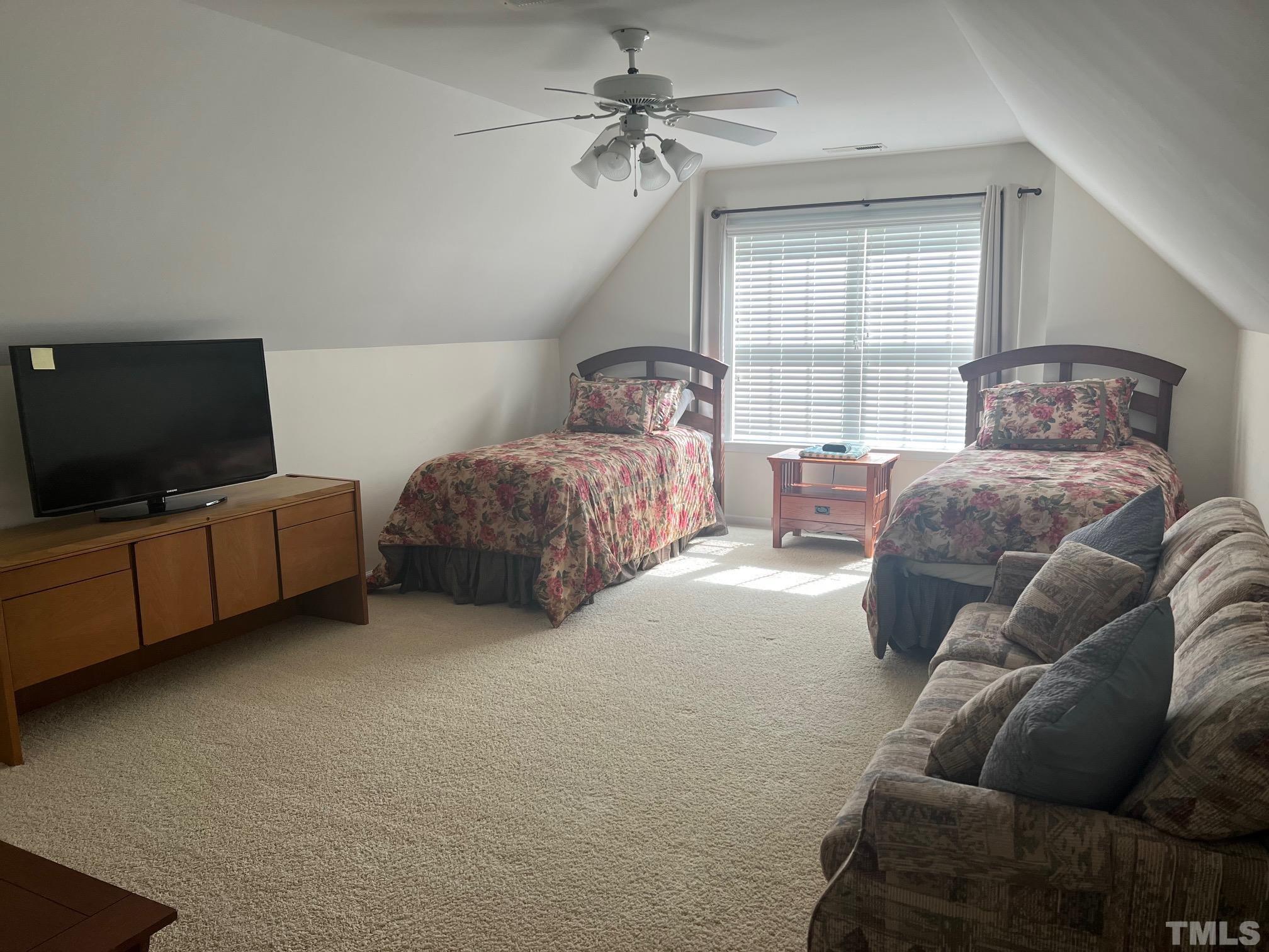 10527 Dapping Drive Raleigh, NC 27614 - Photo 18 of 20 a living room with furniture and a flat screen tv