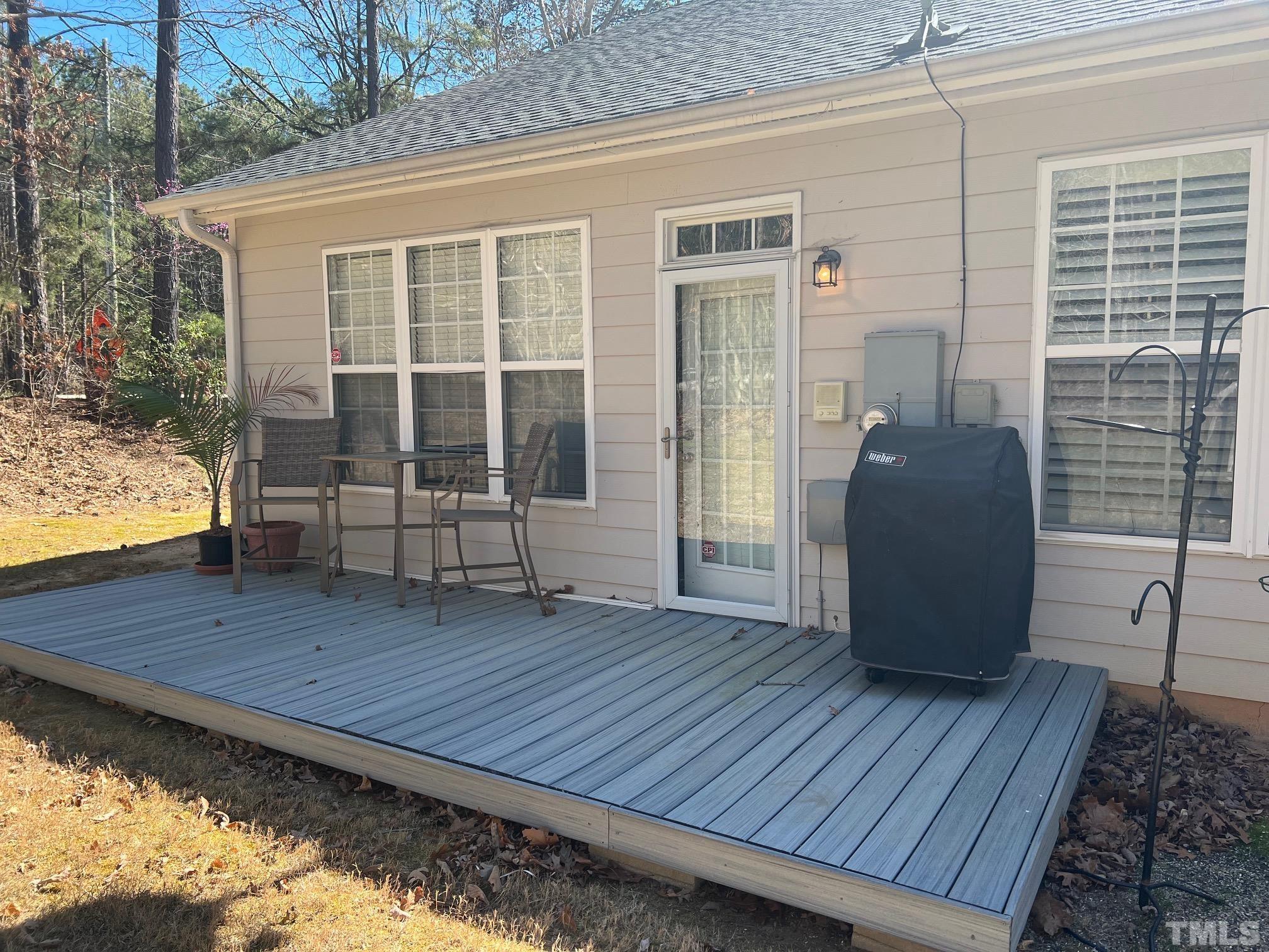 10527 Dapping Drive Raleigh, NC 27614 - Photo 20 of 20 a view of a deck with wooden floor and a yard