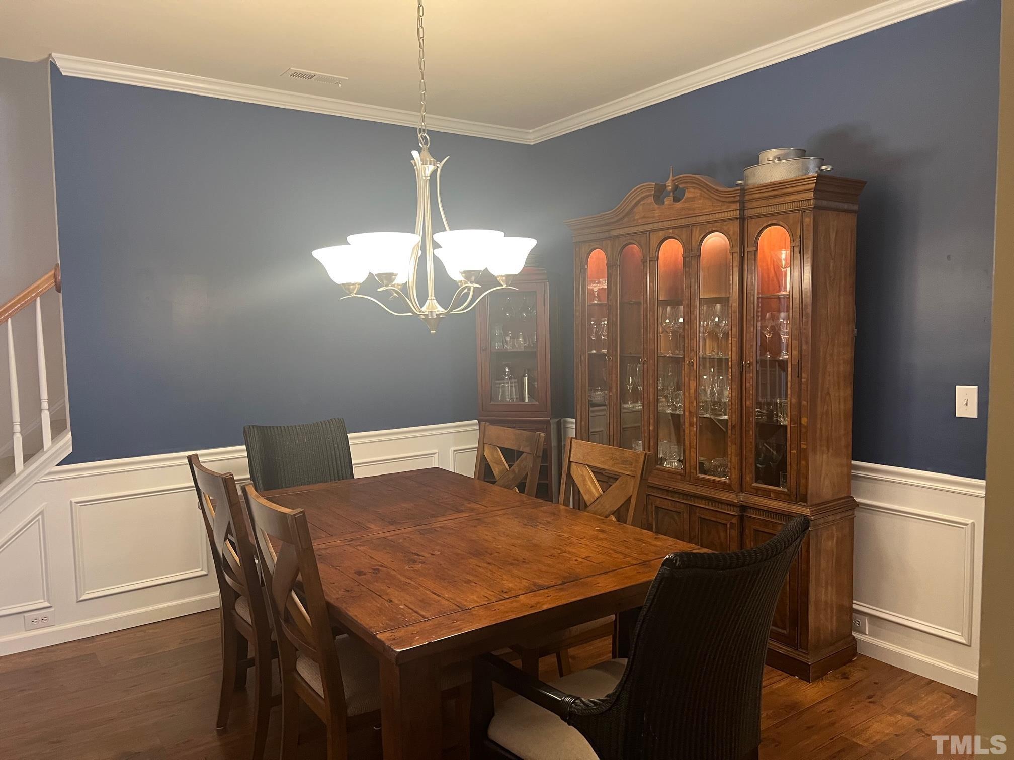 10527 Dapping Drive Raleigh, NC 27614 - Photo 4 of 20 a view of a dining room with furniture wooden floor and chandelier