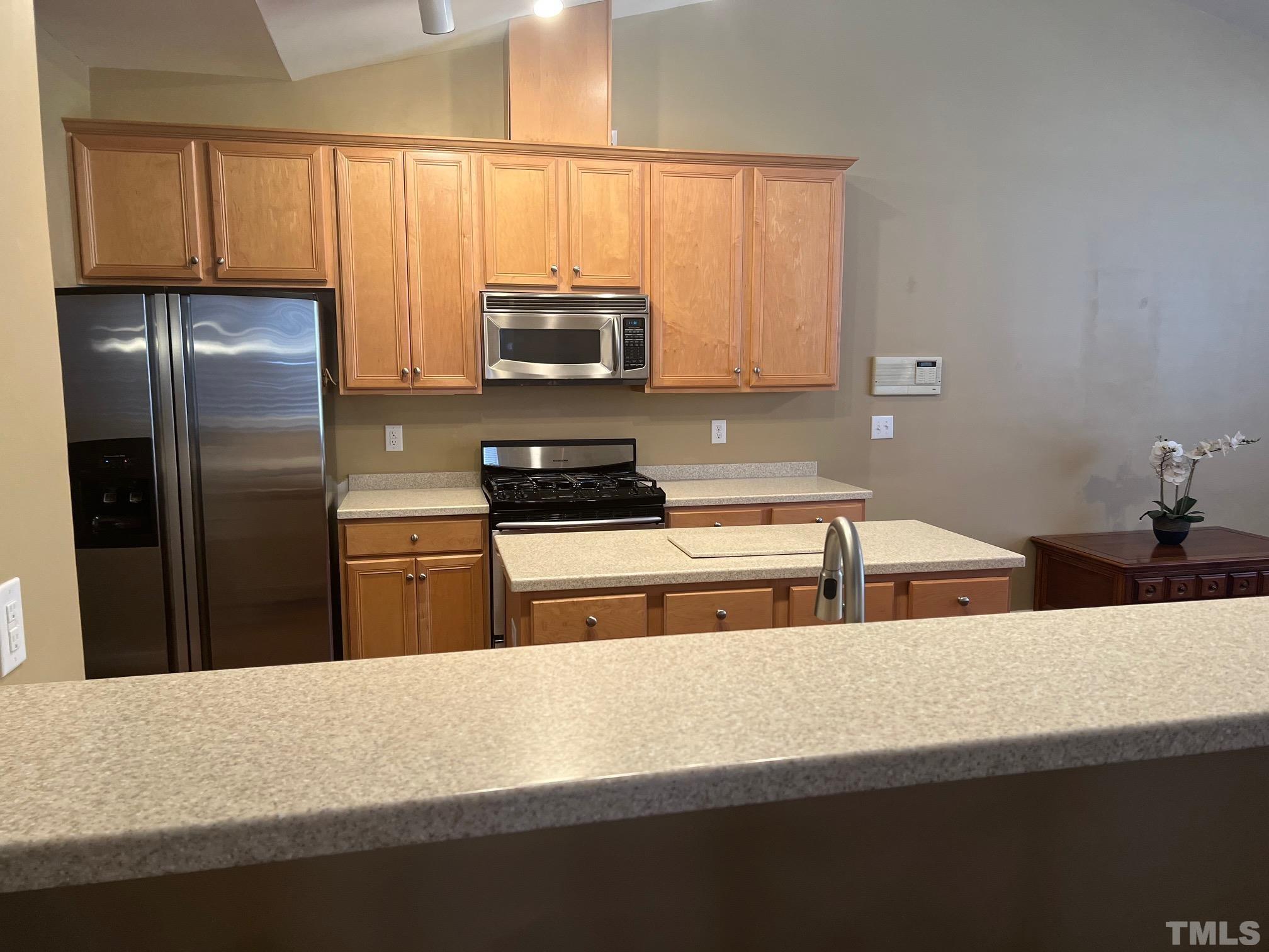 10527 Dapping Drive Raleigh, NC 27614 - Photo 8 of 20 a kitchen with stainless steel appliances a refrigerator sink and microwave