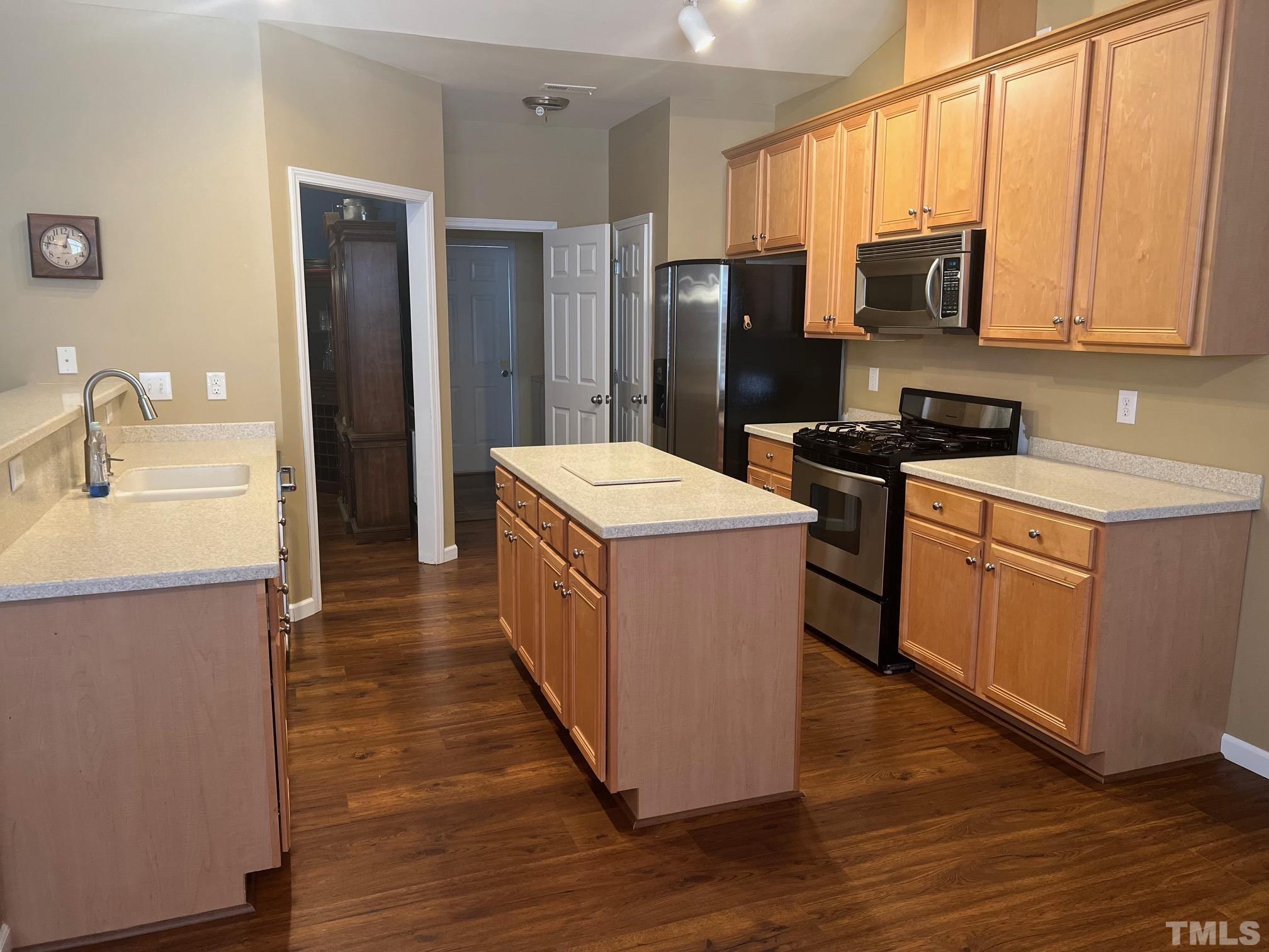 10527 Dapping Drive Raleigh, NC 27614 - Photo 9 of 20 a kitchen with stainless steel appliances granite countertop a refrigerator a stove a sink and a microwave