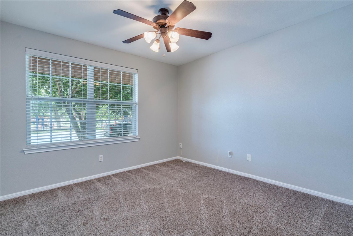 1151 Stone Rim Loop Buda, TX 78610 - Photo 20 of 36 Second bedroom with ceiling fan