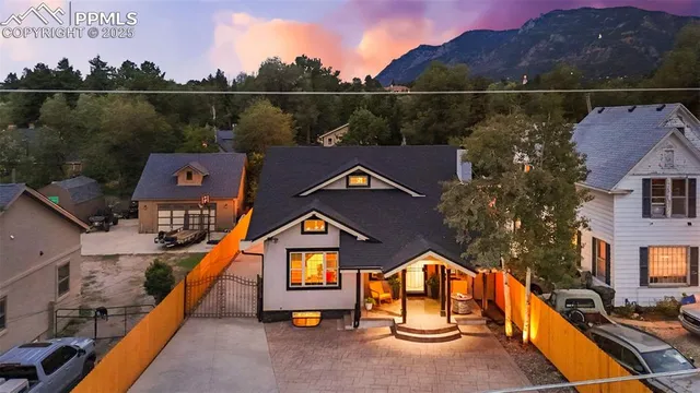 an aerial view of houses with a swimming pool