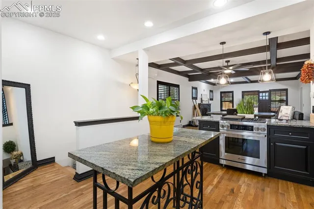 a kitchen with a stove a sink and a refrigerator