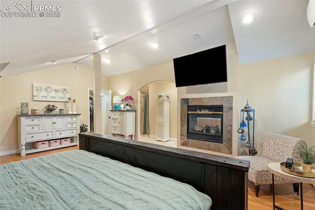 a living room with fireplace furniture and a flat screen tv