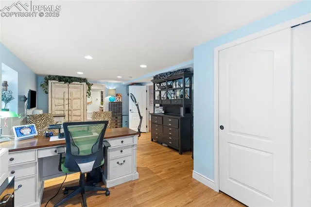 a bathroom with a granite countertop toilet a sink and a mirror