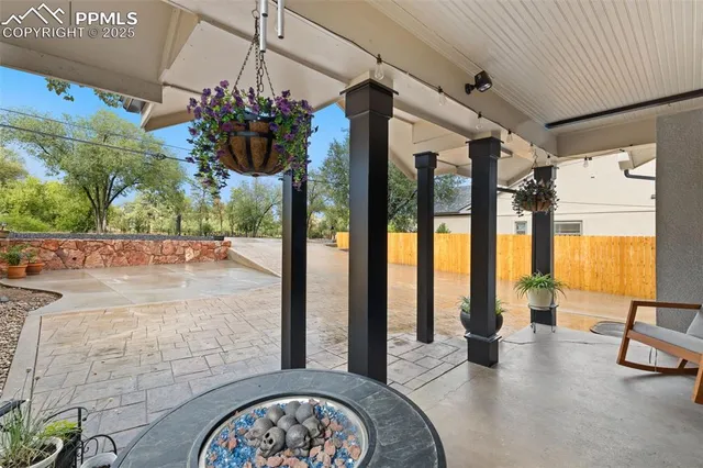 a view of living room with furniture and floor to ceiling window