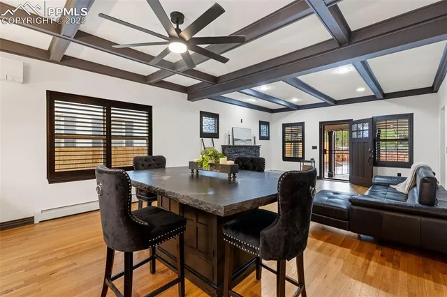 a view of a dining room with furniture window and wooden floor
