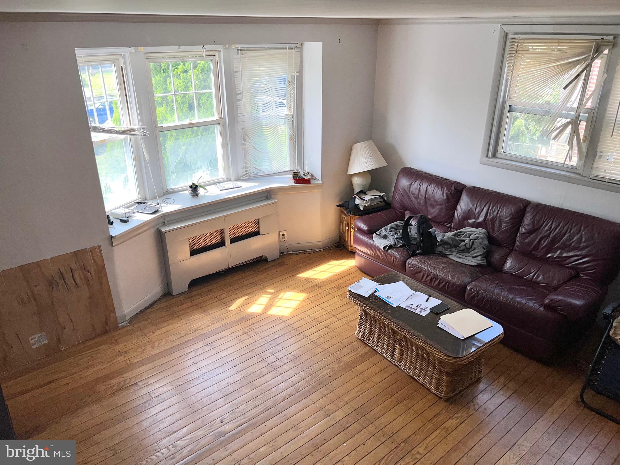 1113 Gilham Street Philadelphia, PA 19111 - Photo 6 of 9 a living room with furniture and a wooden floor
