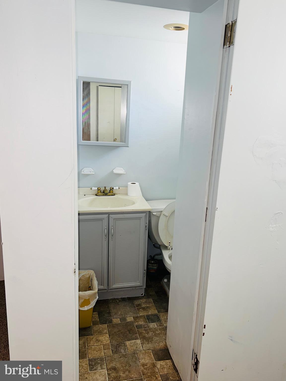 1113 Gilham Street Philadelphia, PA 19111 - Photo 9 of 9 a bathroom with a sink toilet and mirror