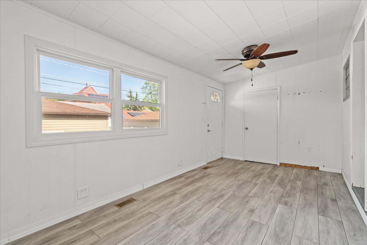 3111 Ruby Street Franklin Park, IL 60131 - Photo 14 of 27 a view of empty room with wooden floor and fan