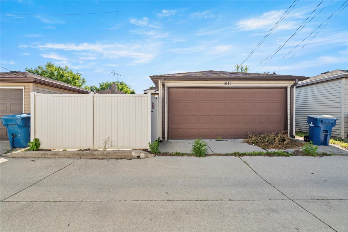 3111 Ruby Street Franklin Park, IL 60131 - Photo 27 of 27 a front view of a house with a yard and garage