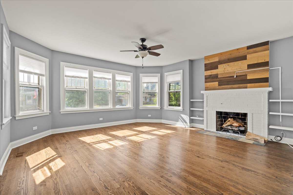 3111 Ruby Street Franklin Park, IL 60131 - Photo 5 of 27 a view of an empty room with wooden floor and a window