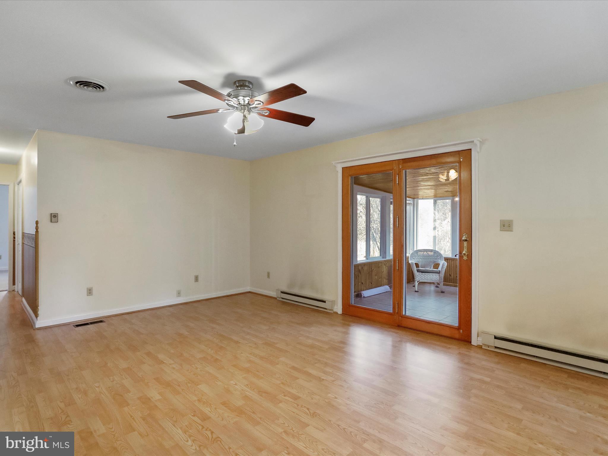 20036 Landis Road Hagerstown, MD 21740 - Photo 28 of 75 Living room walks out to enclosed sunroom.