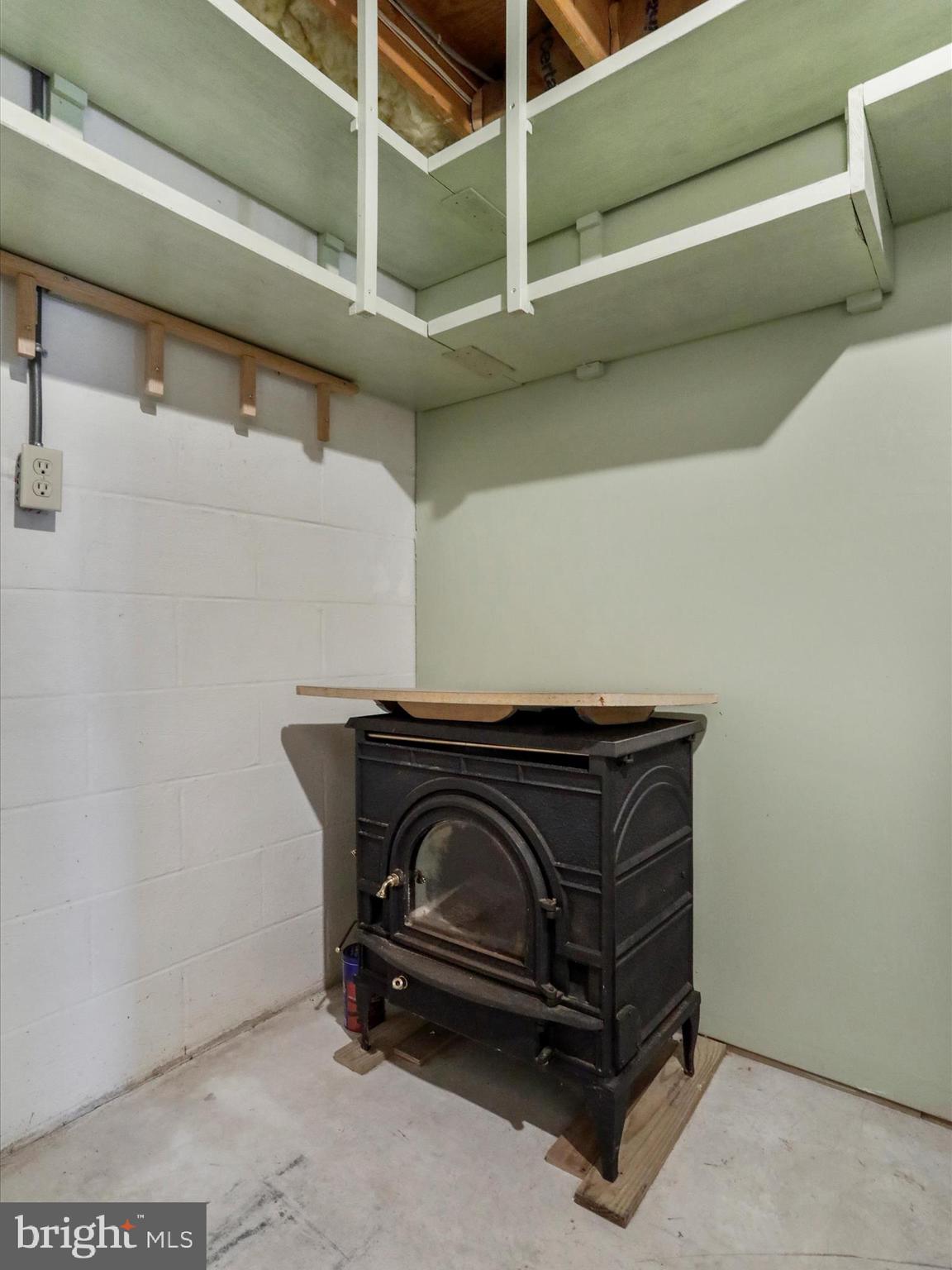 20036 Landis Road Hagerstown, MD 21740 - Photo 75 of 75 Utility room in basement with extra wood stove.