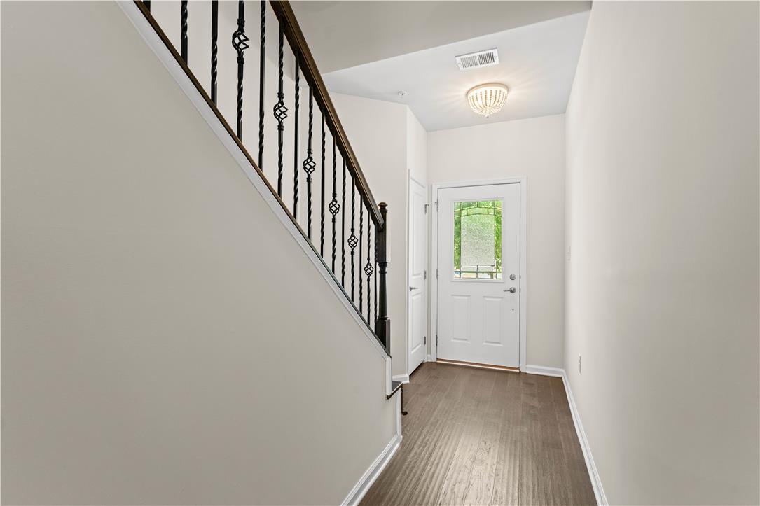 4758 Rafi Road Easton, PA 18045 - Photo 40 of 55 A graceful staircase with ornate wrought iron railings complements the inviting entry with hardwood flooring and an overhead light fixture.