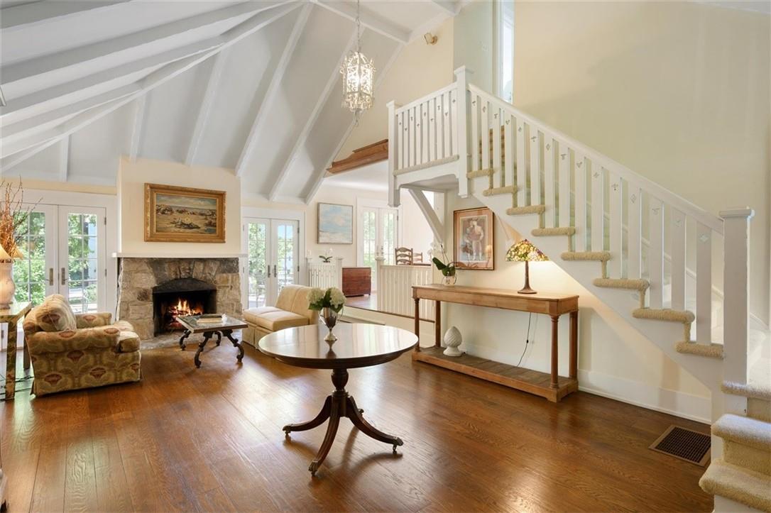 190 Highland Road Rye, NY 10580 - Photo 1 of 1 a living room with furniture a fireplace and wooden floor