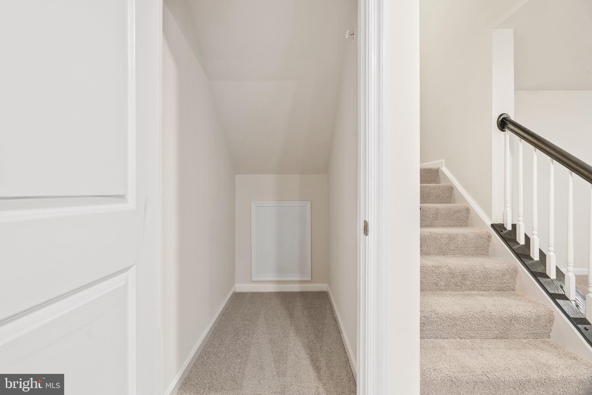 449 Ensemble Way Frederick, MD 21701 - Photo 22 of 64 a view of staircase with white walls and white door
