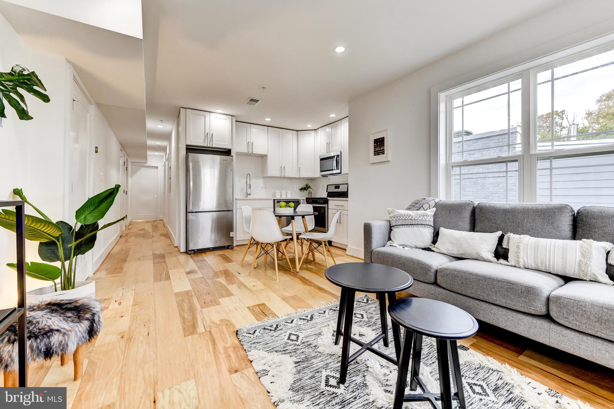 408 Newcomb Street Southeast Washington, DC 20032 - Photo 8 of 8 a living room with furniture and a large window
