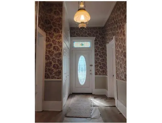 a view of a door of the house with a door