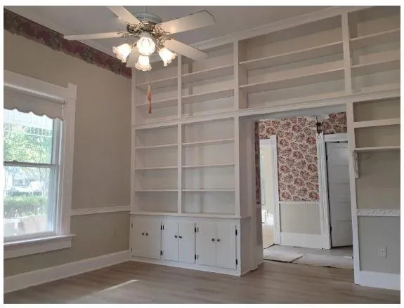 a view of an empty room with a window