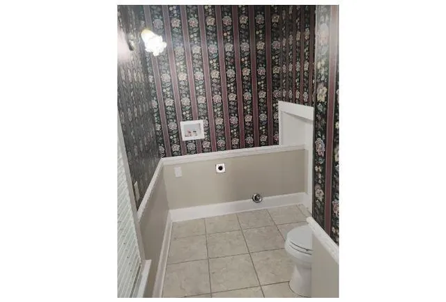 a bathroom with a bathtub and shower