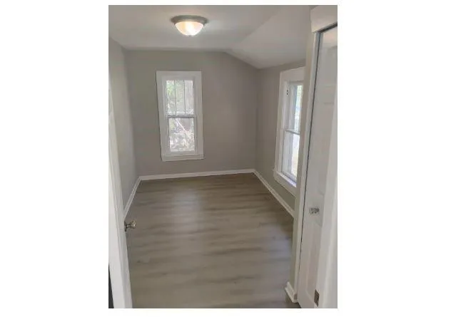 a view of a room that has a window in it