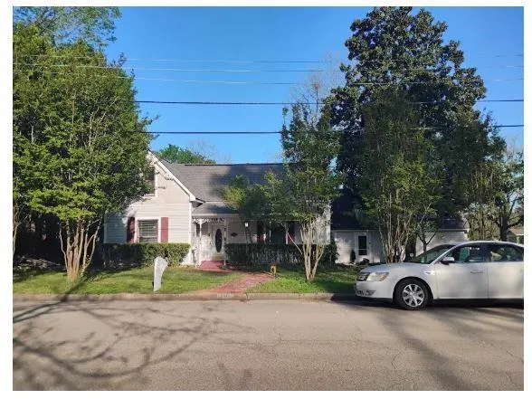 a car parked in front of a house