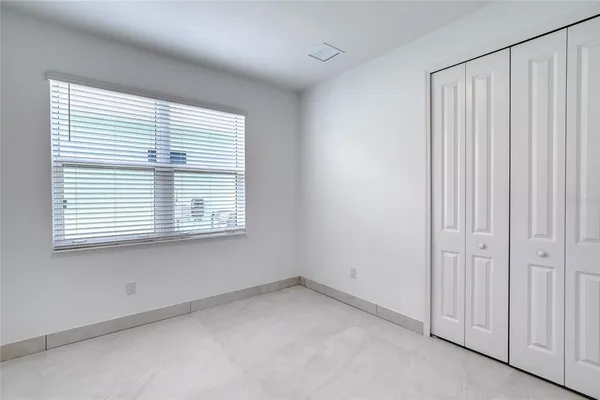 a spacious bathroom with double vanity and mirrors