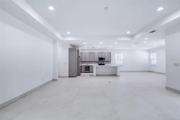 a view of a hallway with wooden shelves