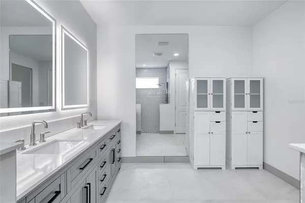 a view of a city with lush green forest