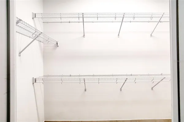 a view of swimming pool with a yard in front of it