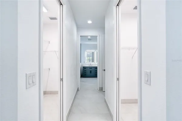 a view of swimming pool with outdoor seating and city view