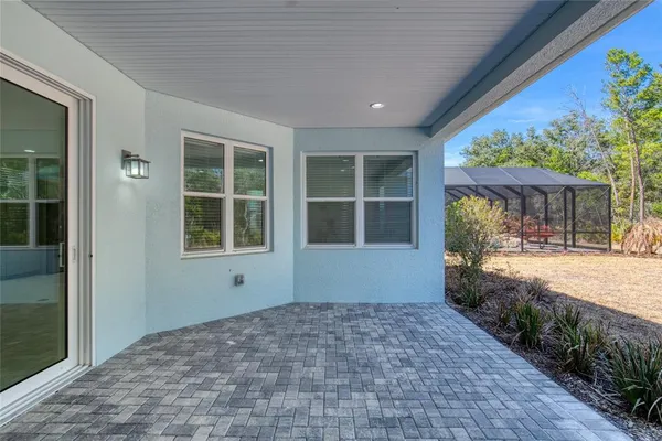 a view of a swimming pool with an outdoor space and seating area