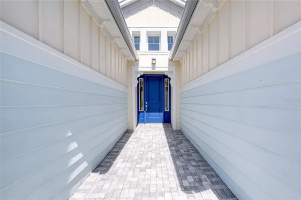 a bathroom with a bathtub shower sink vanity mirror and toilet