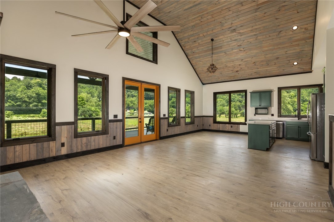790 Howard Edmisten Road Sugar Grove, NC 28679 - Photo 11 of 45 a view of an empty room with a window and wooden floor
