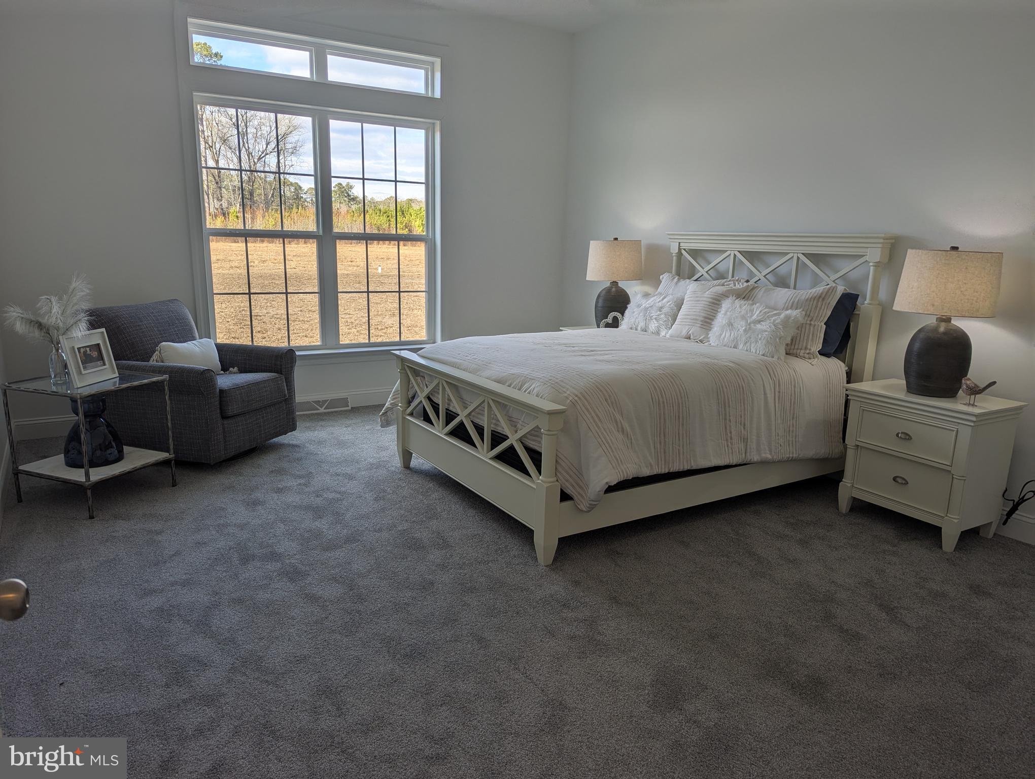 20727 Wilson Road Georgetown, DE 19947 - Photo 12 of 40 a spacious bedroom with a bed and a window