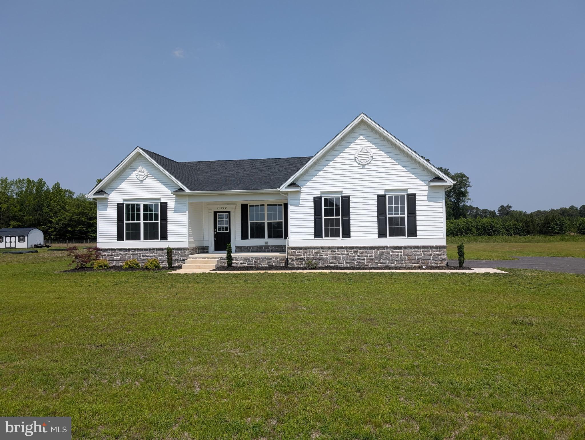20727 Wilson Road Georgetown, DE 19947 - Photo 2 of 40 a front view of a house with garden