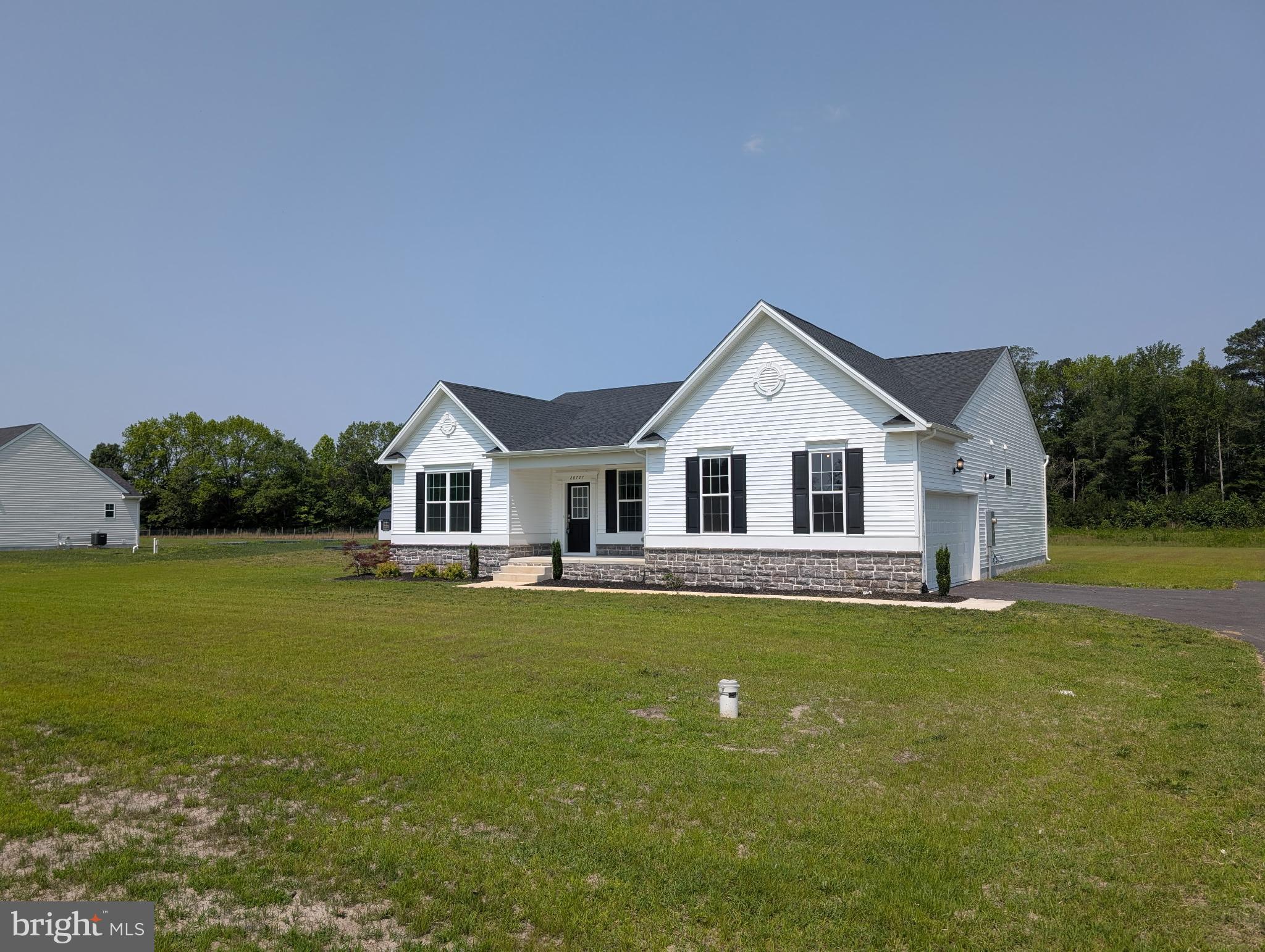 20727 Wilson Road Georgetown, DE 19947 - Photo 4 of 40 a front view of house with yard and swimming pool