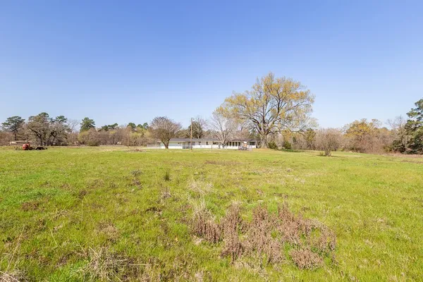 a view of an ocean and a yard