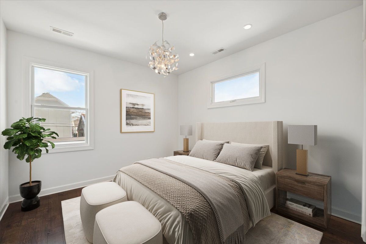 4036 North Parkside Avenue Chicago, IL 60634 - Photo 13 of 28 a bedroom with bed and a chandelier