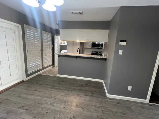 a view of a kitchen with a sink and dishwasher