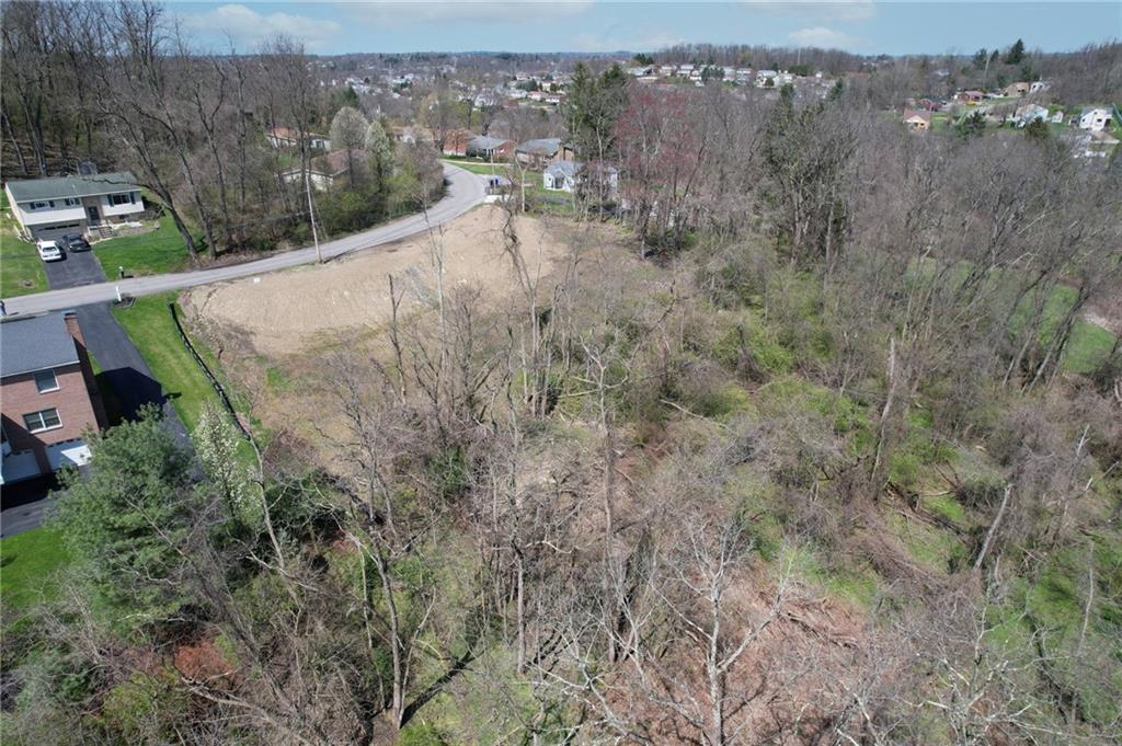 76 Midway Drive McKees Rocks, PA 15136 - Photo 23 of 28 a view of a houses with yard and trees in the background